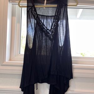 Sheer black sleeve less top with lace detail